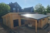 Casa in legno a tetto piatto BERTA (Coibentata PLUS, 44+44 mm), 72 m² + 18 m² di porticato e garage di 20 m² customer 1