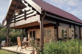Casa in legno con porticato AURA (44+44 mm), 100 m² + 35 m² customer 2