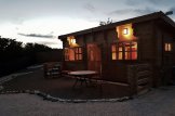 Casa in legno a tetto piatto con porticato ALTURA F S (Coibentata, 44+44 mm), 31m² + 8 m² customer 1
