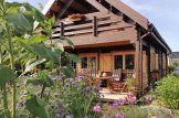 Casa in legno con porticato AURA (44+44 mm), 100 m² + 35 m² customer 1